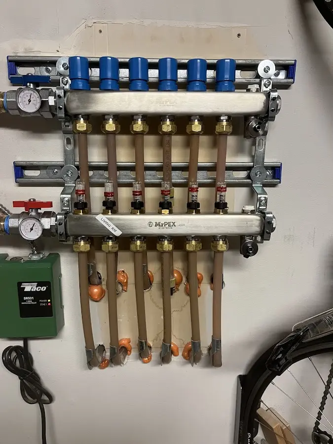 Plumber performing Water Heater Repair at a residential property in McFarland